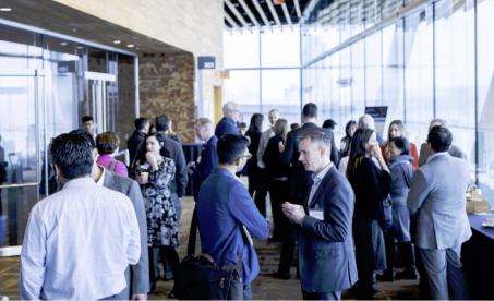 business professionals networking and mingling in a lobby